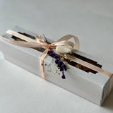 Small gift box with assorted fruit chips mix in carob chocolate and isomalt tea bombs